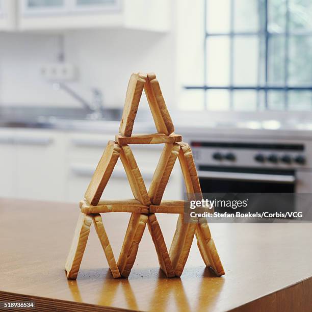 toast stacked into pyramid - food pyramid stock-fotos und bilder