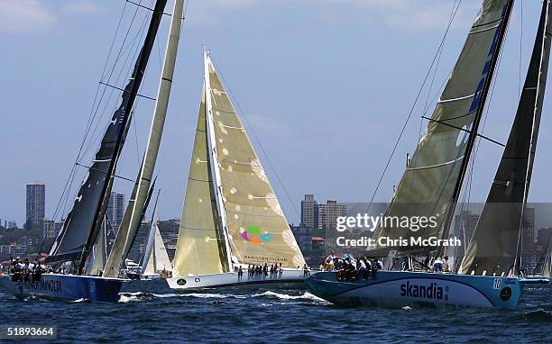 Brindabella passes behind Konica Minolta and Skandia during the start Rolex Sydney Hobart Yacht Race held on Sydney Harbour, December 26, 2004 in...