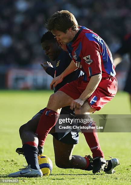 Valery Mezague of Portsmouth battles with Joonas Kolkka of Crystal Palace during the Barclays Premiership match between Crystal Palace and Portsmouth...