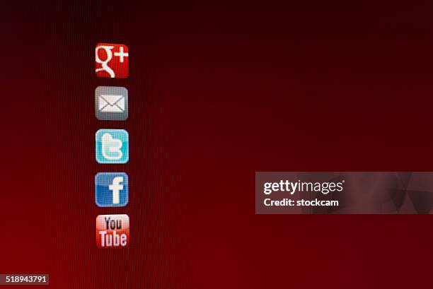 social media symbols on computer screen - google social networking service stock pictures, royalty-free photos & images