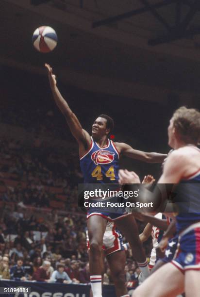 Denver Nuggets guard Ralph Sampson jumps to shoot against the New York Nets with the American Basketball Association.