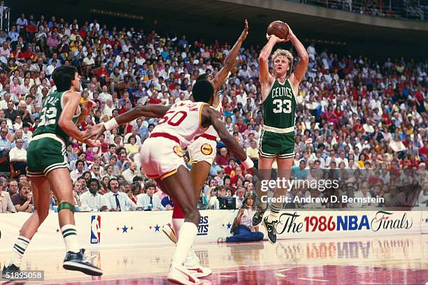 Larry Bird of the Boston Celtics shoots a jumpshot over a Houston Rockets defender during the 1986 NBA Finals at the Summit on June 1, 1986 in...