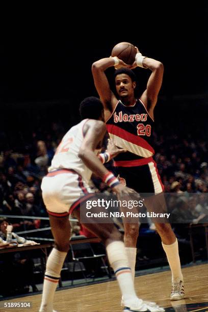 Maurice Lucas of the Portland Trailblazers looks to make a pass against the New York Knicks during the NBA game at Madison Square Garden in New York,...