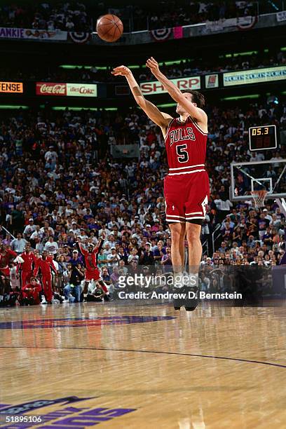 John Paxson of the Chicago Bulls shoots a game winning 3-pointer against the Phoenix Suns during Game Six of the 1993 NBA Finals on June 20, 1993 in...