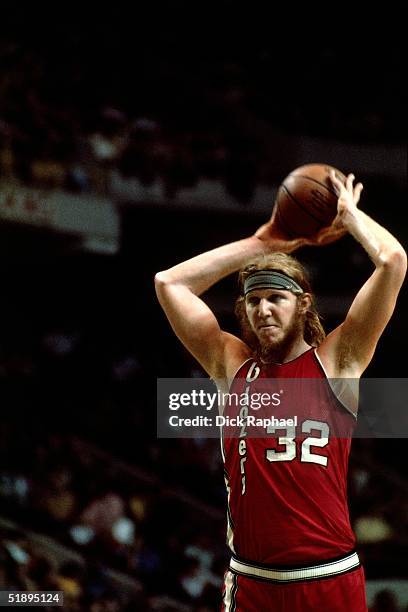 Bill Walton of the Portland Trailblazers looks to make a pass against the Boston Celtics during the NBA game at the Boston Garden in Boston,...