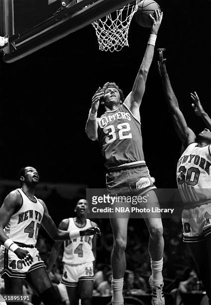 Bill Walton of the San Diego Clippers goes for a layup against the New York Knicks during the NBA game at Madison Square Garden in New York, New...