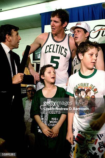 Bill Walton and Danny Ainge of the Boston Celtics are interviewed by sportscaster Brent Musburger after winning the 1987 NBA Championship against the...