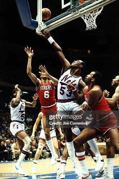 Darryl Dawkins New Jersey Nets battles for a rebound against his former teammates the Philadelphia 76ers during an NBA game in 1983 at Brendan Byrne...