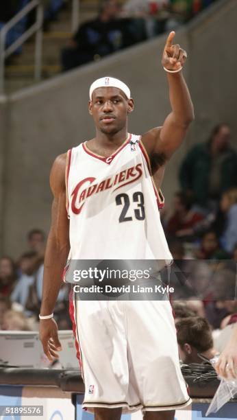 LeBron James of the Cleveland Cavaliers drives points to the crowd during the game against the New Orleans Hornets at Gund Arena on December 26, 2004...