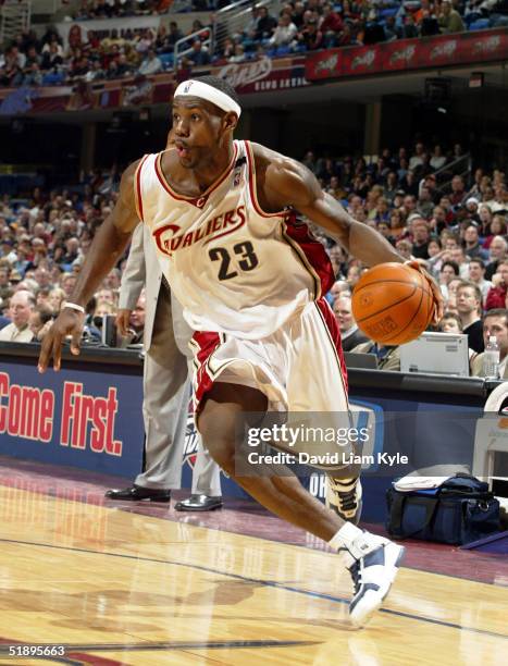 LeBron James of the Cleveland Cavaliers drives to the hoop against the New Orleans Hornets at Gund Arena on December 26, 2004 in Cleveland, Ohio....