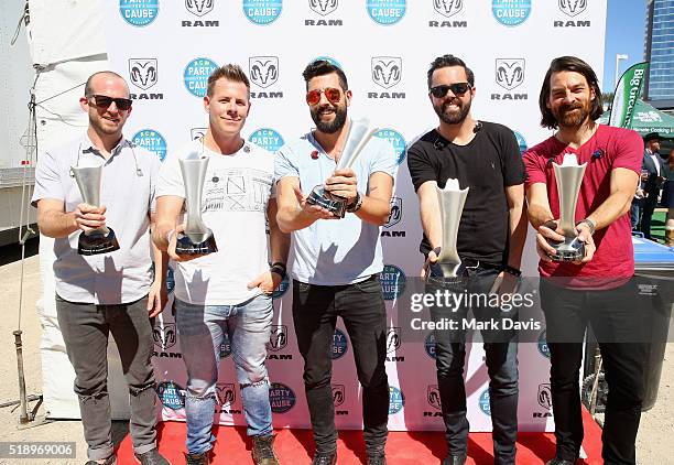 Musicians Whit Sellers, Trevor Rosen, Matthew Ramsey, Geoff Sprung and Brad Tursi of Old Dominion pose with ACM's "New Artist Award" during the 4th...