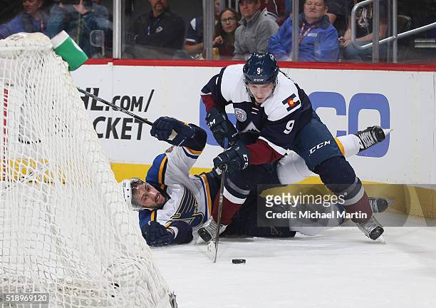 Matt Duchene of the Colorado Avalanche fights for position against Robert Bortuzzo of the St. Louis Blues at the Pepsi Center on April 03, 2016 in...