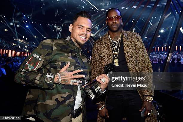 Singer Chris Brown , winner of the award for R&B Artist of the Year, and rapper 2 Chainz pose backstage at the iHeartRadio Music Awards which...