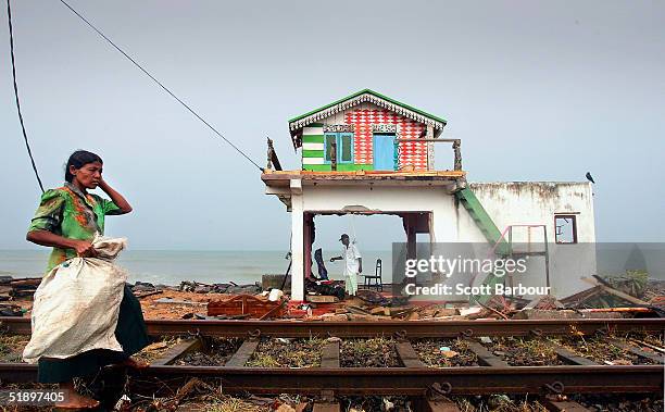 Husband and wife inspect the remains of their home on the coast of the Ratmalana district after the massive tsunami wave swept across coastal Sri...
