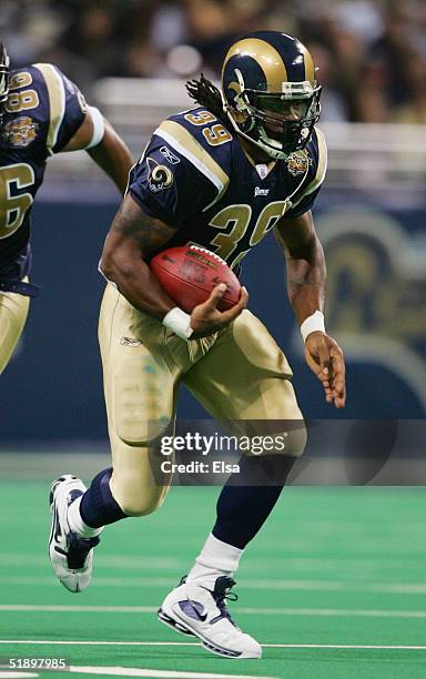 Steven Jackson of the St. Louis Rams runs with the ball against the Seattle Seahawks during the game on November 14, 2004 at the Edward Jones Dome in...