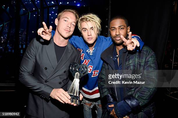 Recording artists Diplo and Justin Bieber, winners of the Best Dance Song award, pose with rapper Big Dean backstage at the iHeartRadio Music Awards...