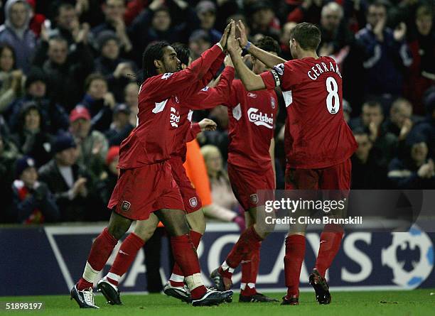 Florent Sinama-Pongolle of Liverpool celebrates scoring the first goal with team-captain Steven Gerrard during the Barclays Premiership match between...