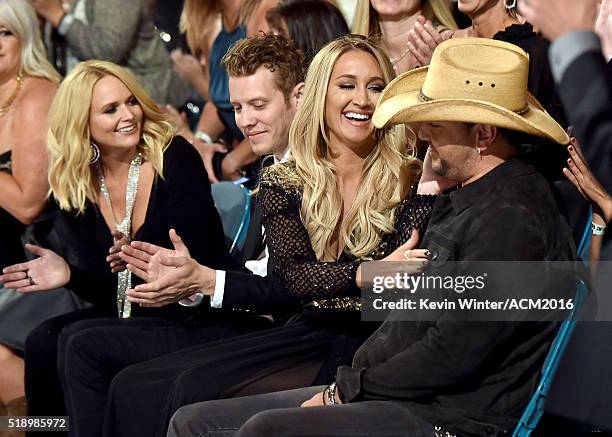 Recording artist Miranda Lambert and Brittany Kerr react as Jason Aldean wins Entertainer of the Year award at the 51st Academy of Country Music...