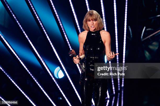 Recording artist Taylor Swift accepts the award for 'Album of the Year,' for '1989,' onstage at the iHeartRadio Music Awards which broadcasted live...