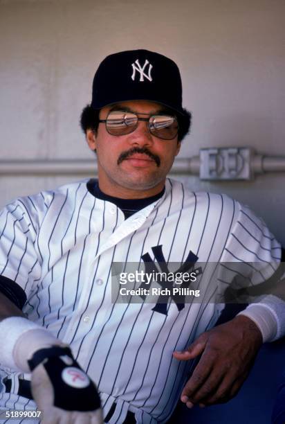 Reggie Jackson of the New York Yankees looks on as he sits in the dougout bench in 1980.