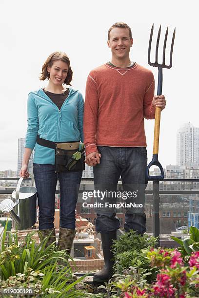 man and woman standing on roof garden - gothic style 個照片及圖片檔