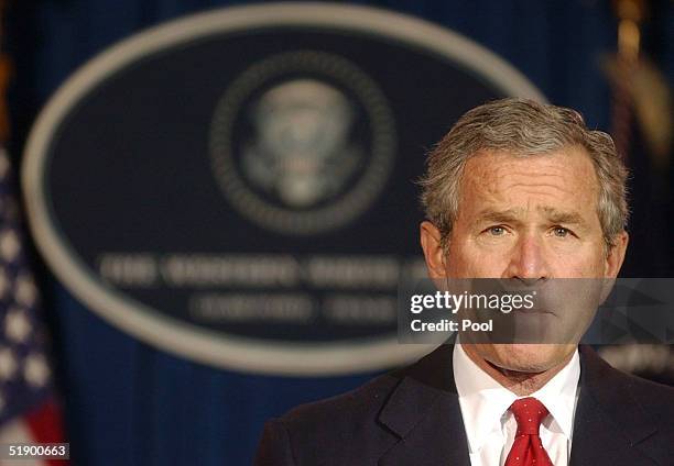 President George W. Bush listens to a question during a news conference at his ranch December 29, 2004 near Crawford, Texas. President Bush spoke on...