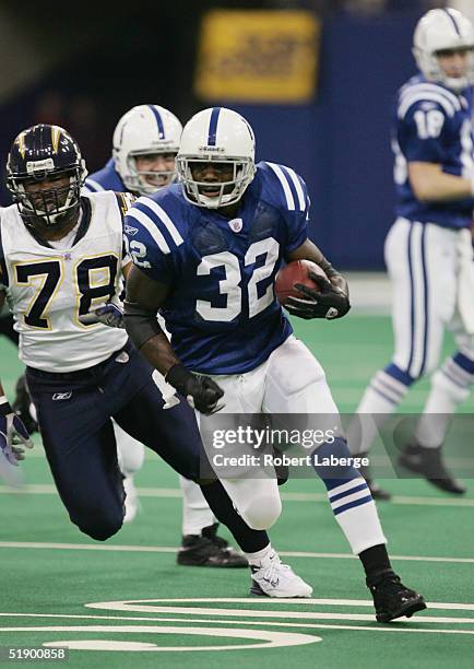 Edgerrin James of the Indianapolis Colts runs the ball against the San Diego Chargers on December 26, 2004 at the RCA Dome in Indianapolis, Indiana....