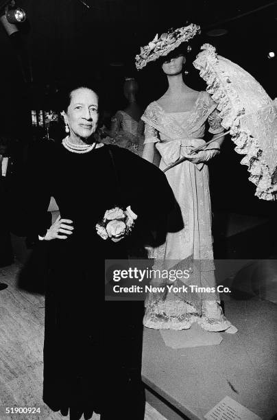 French-born fashion editor Diana Vreeland , in a dress designed by Mm. Gress, poses at the opening of an exhibiton of Hollywood costumes at the...