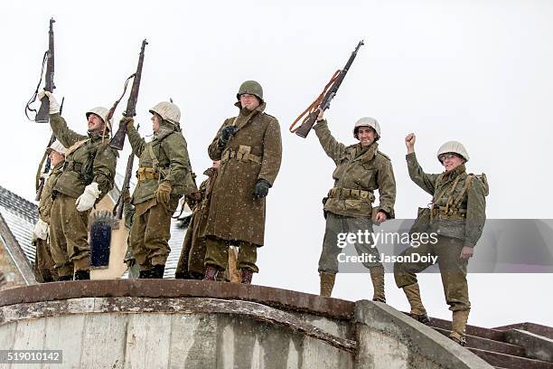 world war ii: victory cheer after storming bunker - british veterans stockfoto's en -beelden