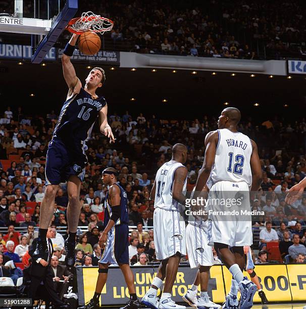 Pau Gasol of the Memphis Grizzlies dunks during a game against the Orlando Magic at TD Waterhouse Centre on December 4, 2004 in Orlando, Florida. The...