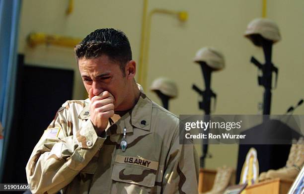 Samuel Martinez sheds tears at a memorial service for six members of the 1st Brigade, 25th Infantry Division December 29, 2004 in Fort Lewis,...