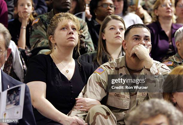Shannon and Steven Chelossi attend a memorial service for six members of the 1st Brigade, 25th Infantry Division December 29, 2004 in Fort Lewis,...