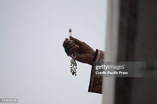 The head priest displays the relic, believed to be the hair from the beard of the Prophet Mohammad , during special prayers on the death anniversary...