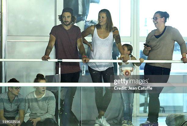 Laure Manaudou, her boyfriend Jeremy Frerot, singer of 'Frero Delavega', and her daughter Manon Bousquet attend day 6 of the French National Swimming...