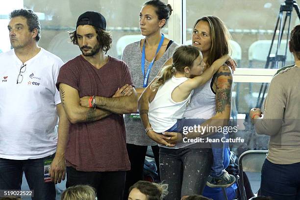 Laure Manaudou, her boyfriend Jeremy Frerot, singer of 'Frero Delavega', and her daughter Manon Bousquet attend day 6 of the French National Swimming...