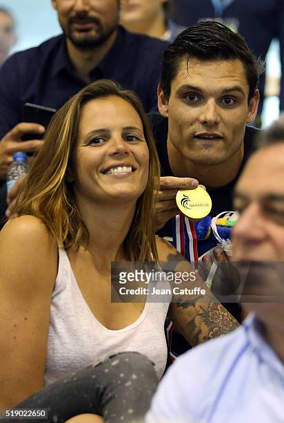 Laure Manaudou celebrates the gold medal won by her brother Florent Manaudou in the men's 50m freestyle final, qualifying him for the Olympic Games...
