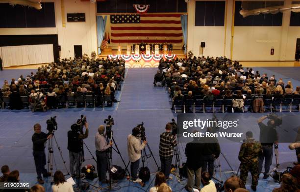 Family and friends attend a memorial service for six members of the 1st Brigade, 25th Infantry Division December 29, 2004 in Fort Lewis, Washington....