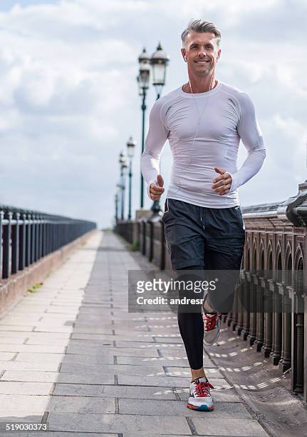 man running outdoors - handsome people stock pictures, royalty-free photos & images