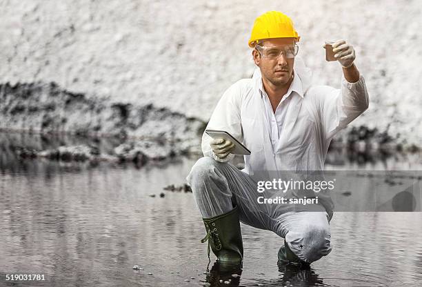 pollution scientist at work - scientist full length stock pictures, royalty-free photos & images