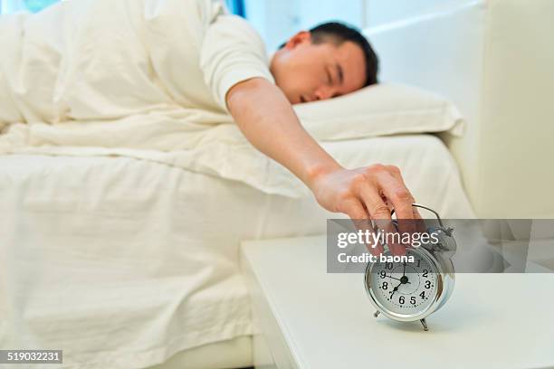 alarm clock - hitting alarm clock stock pictures, royalty-free photos & images