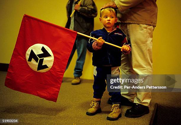 Unidentified members of AWB , a right wing movement, hold their flags on June 12, 2004 in central Potchefstrom, South Africa. Eugene Terre Blanche,...