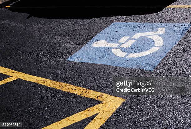 disabled logo or road marking on parking bay - handicap parking space stock pictures, royalty-free photos & images