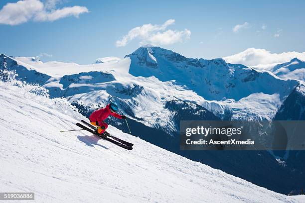 female athlete skiing in the mountains - extreme skiing stock pictures, royalty-free photos & images