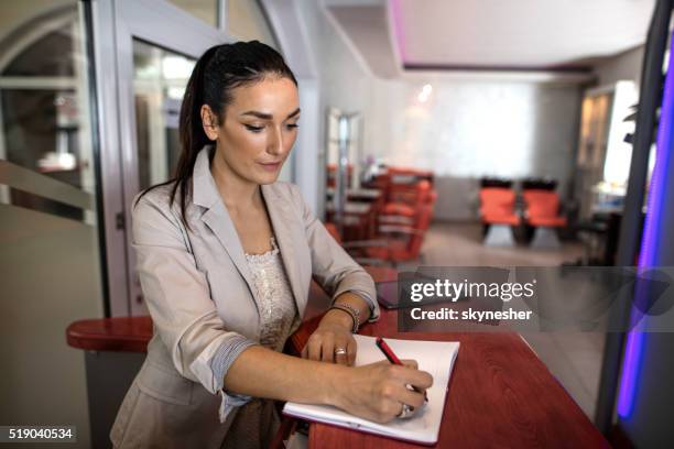 Receptionist Notes Salon Receptionist Photos and Premium High Res Pictures - Getty Images