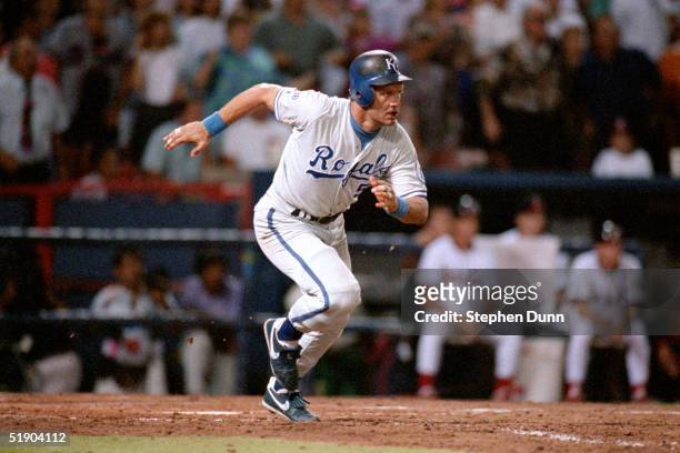 George Brett of the Kansas City Royals runs out of the batters box onto first base as he gets his 3000 career hit against the California Angels on...