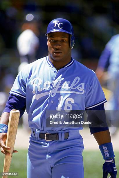 Bo Jackson of the Kansas City Royals walks on the field with his bat on hand during a game in the 1990 season.