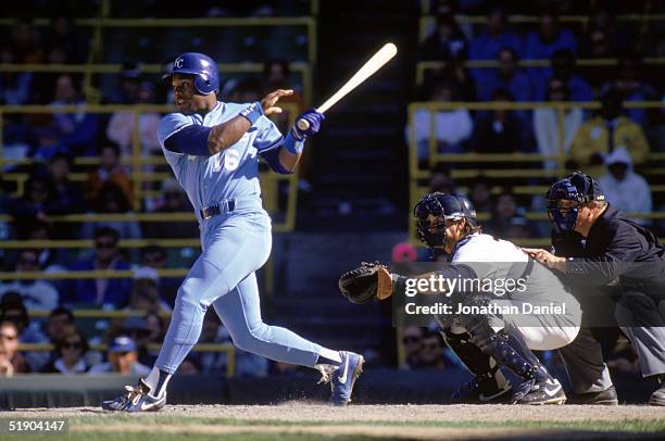Bo Jackson of the Kansas City Royals watches the flight of the ball as he follows through on his swing during a game in the 1990 season.