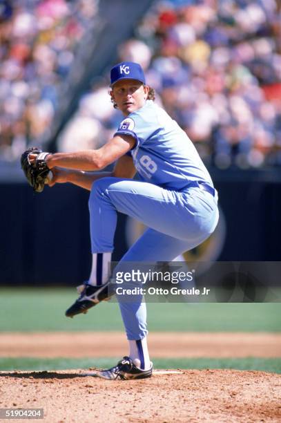 Bret Saberhagen of the Kansas City Royals winds up for a pitch during a game against the Oakland Athletics at Oakland-Alameda County Coliseum in 1989...