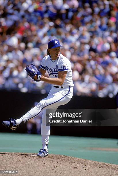 Bret Saberhagen of the Kansas City Royals winds up for a pitch during a game in 1990 at Royals Stadium in Kansas City, Missouri.
