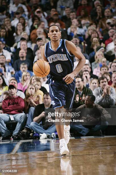 Howard Eisley of the Utah Jazz moves the ball during the game with the Dallas Mavericks on December 4, 2004 at the American Airlines Center in...